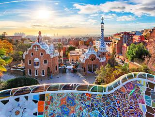 A vibrant cityscape at sunset, highlighting architectural features and colourful murals | MSC Cruises