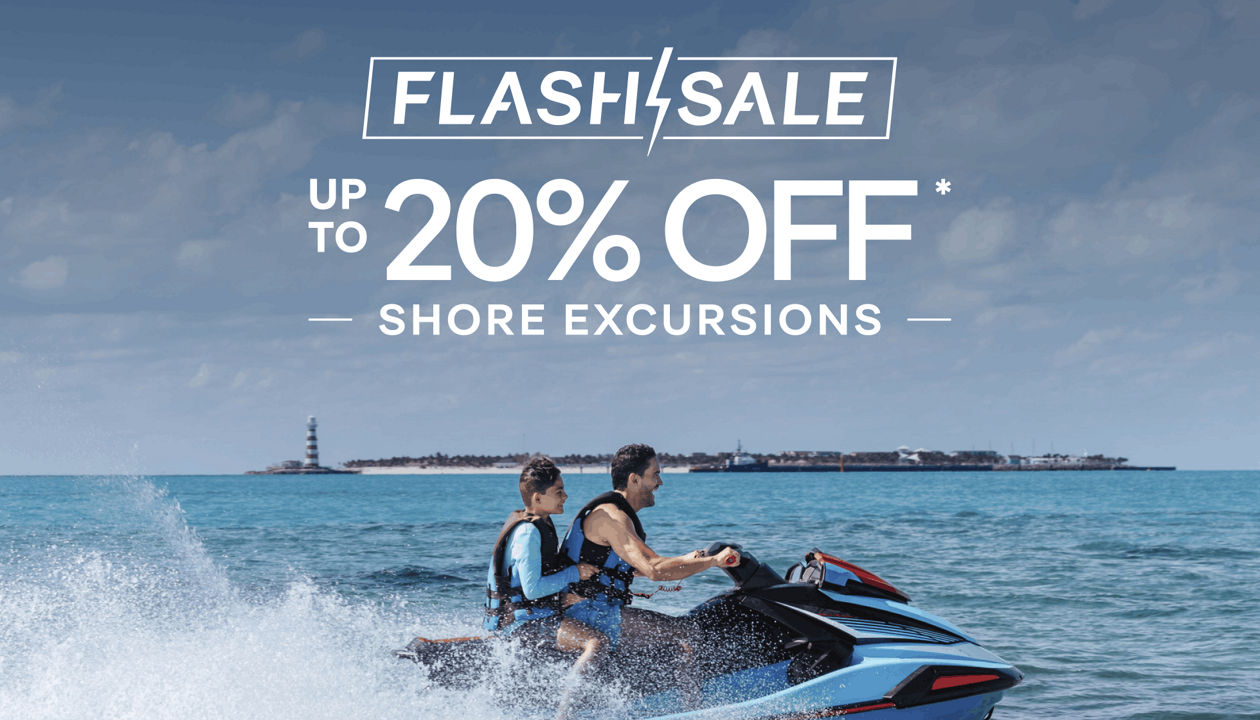 Two people ride a jet ski on turquoise water with a cruise ship visible in the distance | MSC Cruises