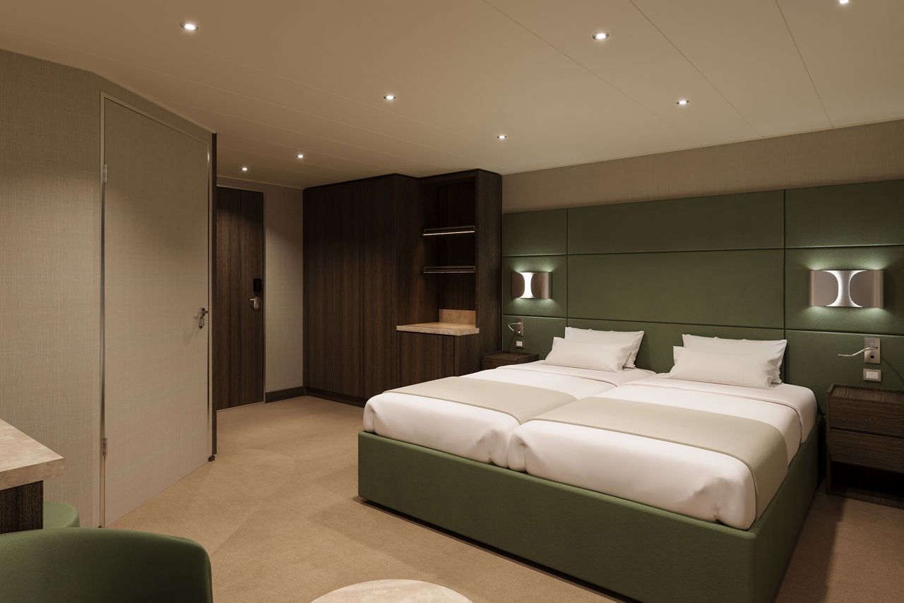 Cozy room with a double bed and modern interior details | MSC Cruises