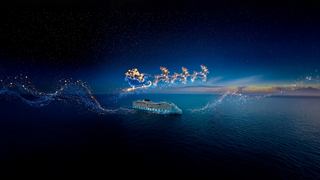Silhouette des Schlittens des Weihnachtsmanns vor funkelndem Nachthimmel über dem Ozean | MSC Cruises