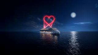 A ship on calm waters under moonlight with a heart symbolizing a romantic journey | MSC Cruises