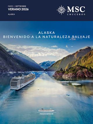 Un barco navega por aguas tranquilas rodeado de picos montañosos y colinas verdes | MSC Cruceros