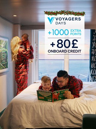 An adult and child share a joyful moment together in a cabin with an ocean view | MSC Cruises