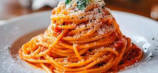 A generous serving of spaghetti topped with rich sauce and garnished with fresh herbs | MSC Cruises