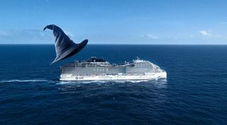 El barco de MSC Cruises navega por el mar mientras un delfín salta cerca | MSC Cruceros