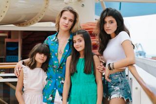 A family enjoys time together on a cruise, dressed in summer attire | MSC Cruises