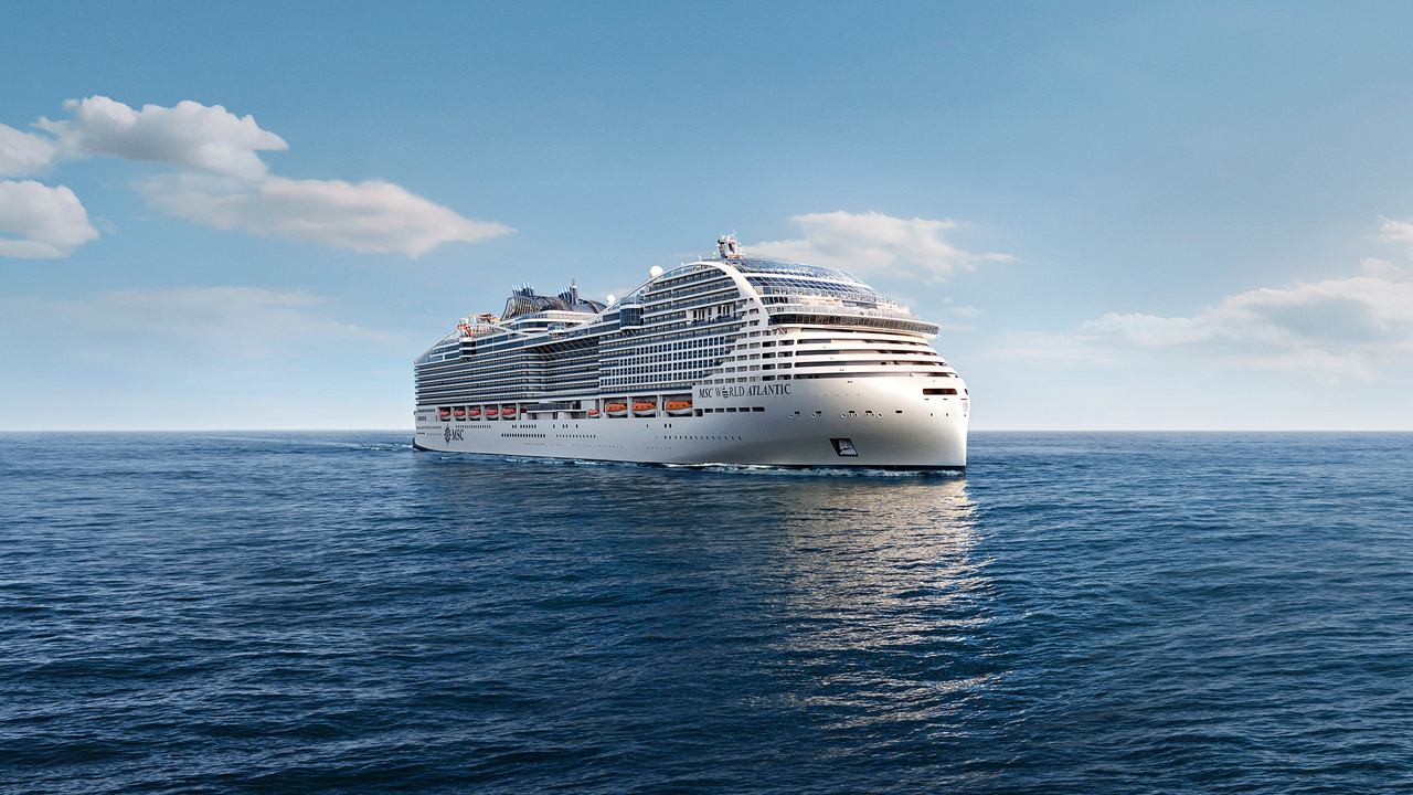 MSC World Atlantic glides over serene waters beneath a clear blue sky | MSC Cruises