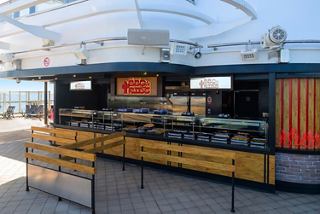 Modern outdoor bar serves refreshing drinks and invites relaxation in open air | MSC Cruises