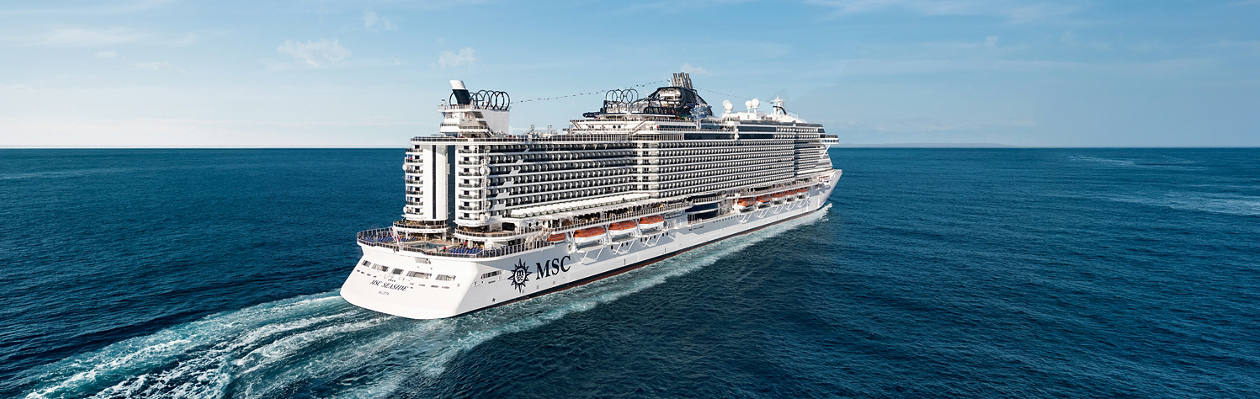 MSC Seaside cruise ship sails across open blue sea under a clear sky | MSC Cruises