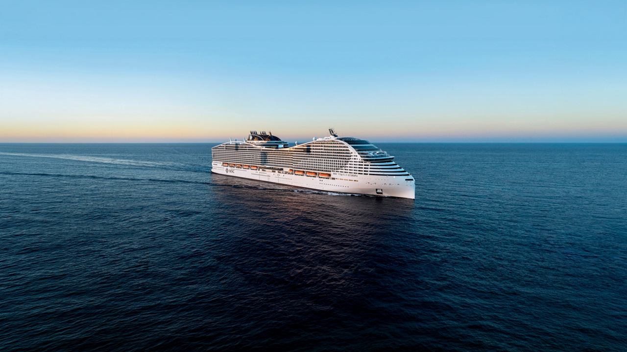 Luxurious MSC cruise ship sailing on open sea at sunset | MSC Cruises