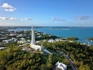 Coastal landscape with a lighthouse and ocean backdrop | MSC Cruises