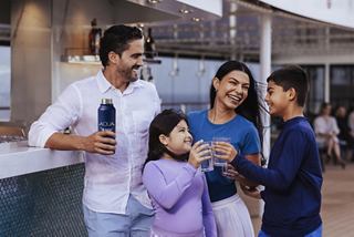A family enjoys time together on a cruise, sharing smiles and fun | MSC Cruises