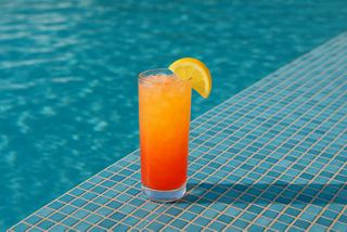 Refreshing citrus drink placed beside blue water | MSC Cruises