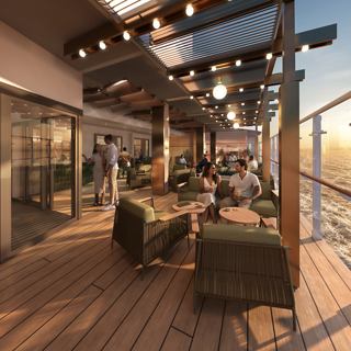 Terraces bar & lounge ​, MSC World Asia - Terrace with tables and chairs overlooking the sea at sunset | MSC Cruises