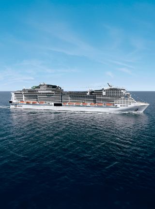 The MSC Grandiosa ship sails serenely on the vast blue ocean | MSC Cruises