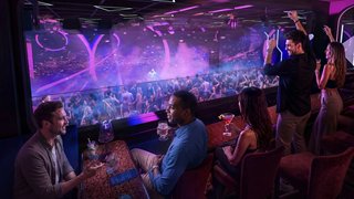 Guests enjoy vibrant entertainment in the Luna Park venue with a lively atmosphere | MSC Cruises