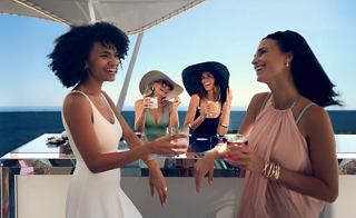 Two women and a child enjoy drinks on board a ship, celebrating a sunny day | MSC Cruises