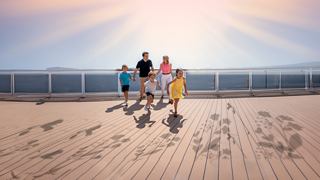 A family strolls along the beach, enjoying a sunny day | MSC Cruises