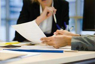 Discussion about important documents in an office environment | MSC Cruises