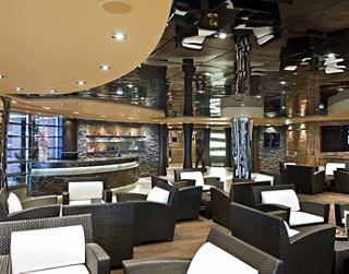 A stylish bar area with comfortable seating and elegant decor for relaxation and socialising | MSC Cruises