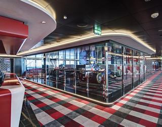 A vibrant entertainment area featuring F1 simulators for thrilling racing experiences | MSC Cruises