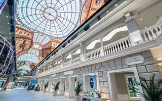 A vibrant atrium with a stunning glass ceiling, inviting guests to explore and relax in a luxurious atmosphere | MSC Cruises