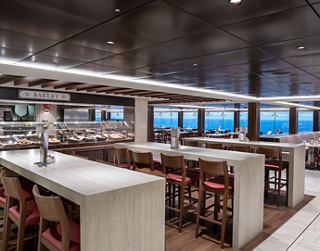 Modern restaurant area with panoramic windows and elegant seating | MSC Cruises