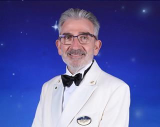 Captain Leotta with hands behind back in cruise ship setting | MSC Cruises