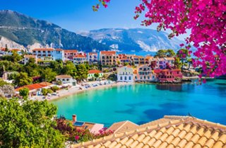 Idyllic bay with crystal clear water and green hills at Assos in Kefalonia | MSC Cruises
