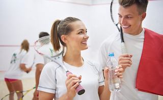 Two squash players smile at each other while preparing for a match | MSC Cruises