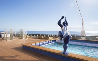 A person enjoying the serenity of the horizon pool with a stunning sea view in the background | MSC Cruises