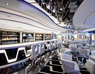 The modern bar on Grandiosa offers a cozy setting for relaxation and socializing | MSC Cruises