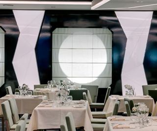 Modern restaurant with elegant tables and large lighting | MSC Cruises