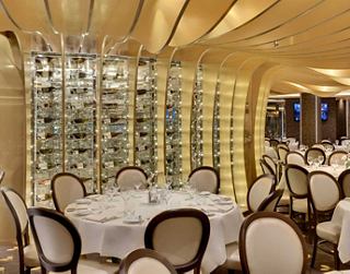 Elegant dining space featuring beautifully set tables and warm lighting | MSC Cruises