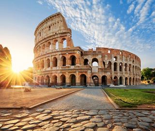 The Colosseum bathed in golden sunlight, embodying the rich history of Rome | MSC Cruises