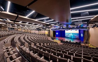 Interior of the theater featuring rows of seats and a large screen | MSC Cruises