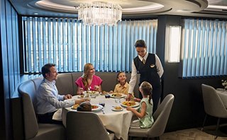 A family is enjoying lunch in a restaurant at sea | MSC Cruises