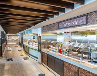 A spacious buffet area with various food stations and a welcoming atmosphere for guests to enjoy | MSC Cruises