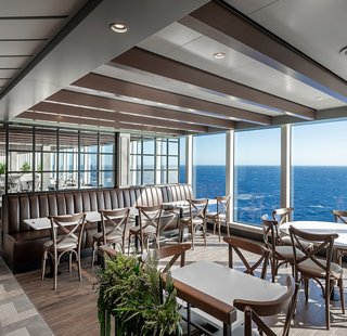Modern restaurant with panoramic sea views and spacious tables | MSC Cruises