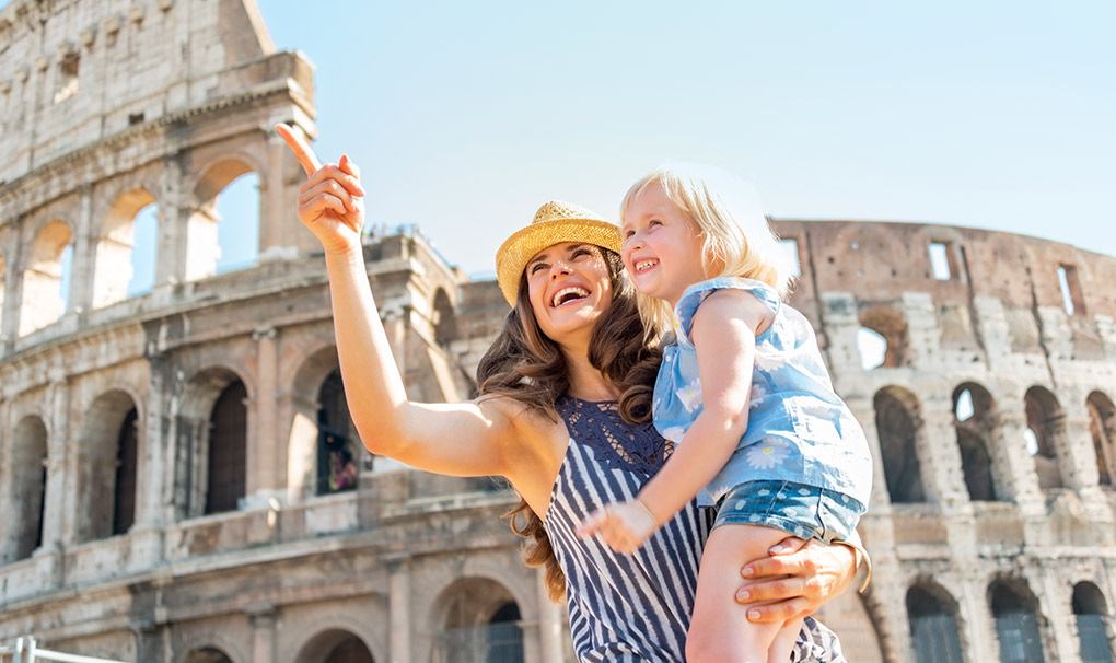 A mother and child share a joyful moment at the Colosseum in Rome | MSC Cruises