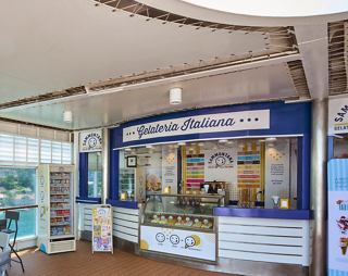 Ice cream bar offering a variety of flavors in a cozy setting | MSC Cruises