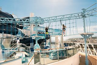 Himalayan Bridge and waterslide on MSC Meraviglia with people enjoying the Polar Aquapark | MSC Cruises