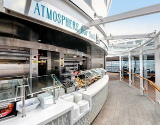 Atmosphere bar on deck serving drinks with ocean views aboard a cruise ship | MSC Cruises