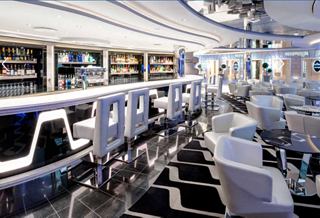 Contemporary lounge bar with spacious seating and elegant décor on a cruise ship | MSC Cruises