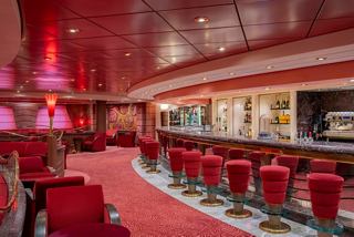 Bar and inviting seating area in the warm atmosphere of MSC Poesia | MSC Cruises