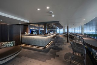 Botanic Garden Bar on MSC World Europa welcomes guests with stylish seating and a relaxing lounge atmosphere | MSC Cruises