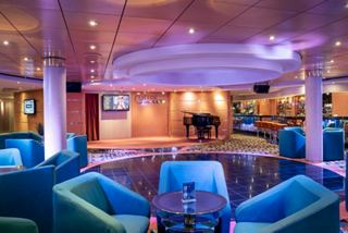 Cotton Club lounge with piano and bar area on MSC Opera | MSC Cruises