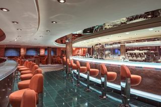 Crystal Lounge on MSC Musica features a modern bar area with comfortable seating and vibrant decor | MSC Cruises
