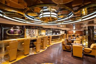 Inviting lounge with armchairs and tables in Il Cappuccino bar on MSC Fantasia | MSC Cruises