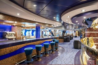Bar and lounge with stylish seating and vibrant blue accents aboard MSC Splendida | MSC Cruises